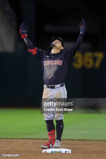 Andres Gimenez of the Cleveland Guardians reacts after he hit a double that scored a run against the Oakland Athletics in the seventh inning at...