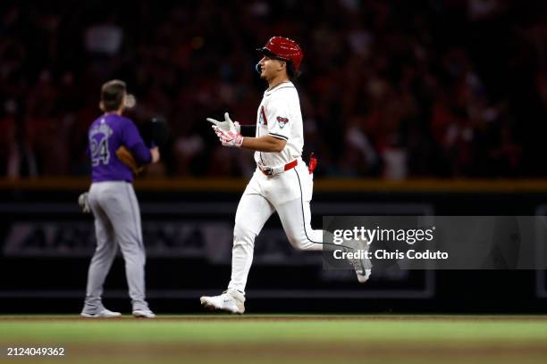 Alek Thomas of the Arizona Diamondbacks reacts after hitting a three run home run against the Colorado Rockies during the sixth inning at Chase Field...