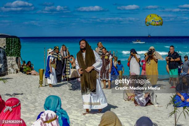 Man playing the role of Jesus Christ speaks during the representation of 'The Way of The Cross' as part of the Holy Week celebrations at Playa...