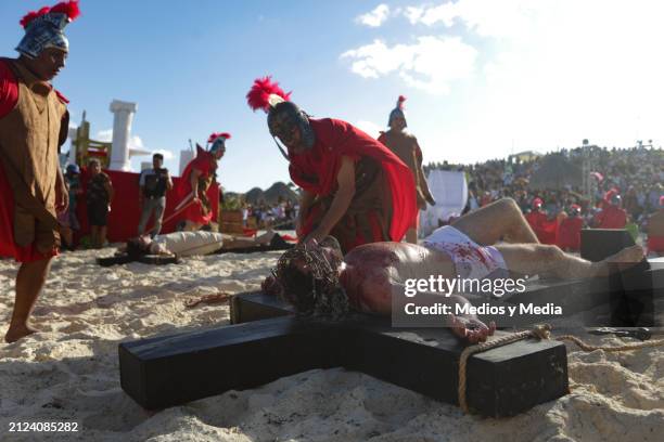 Man playing the role of Jesus Christ is crucified during the representation of 'The Way of The Cross' as part of the Holy Week celebrations at Playa...