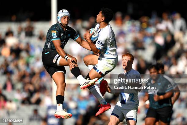Christian Leali'ifano of Moana competes with Stephen Perofeta of the Blues during the round six Super Rugby Pacific match between Moana Pasifika and...