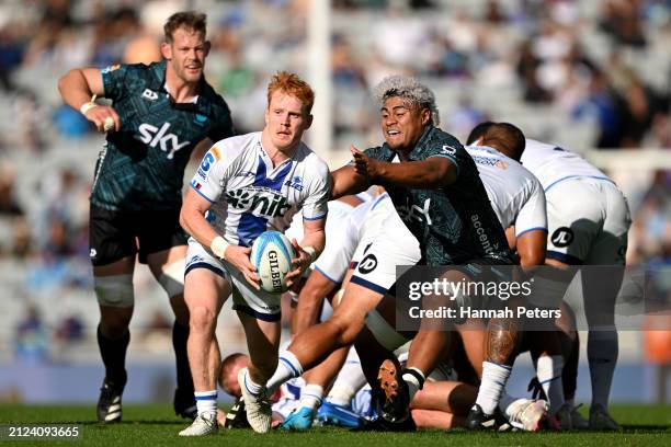 Finlay Christie of the Blues passes the ball during the round six Super Rugby Pacific match between Moana Pasifika and Blues at Eden Park, on March...