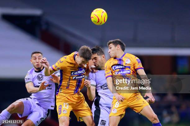 Rodrigo Dourado of San Luis fights for the ball wth Nestor Araujo of America during the 13th round match between America v Atletico San Luis as part...