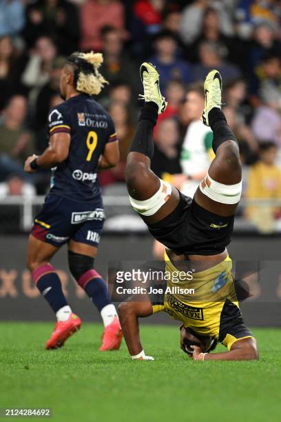 Peter Lakai of the Hurricanes celebrates after scoring a try during the round six Super Rugby Pacific match between Highlanders and Hurricanes at...