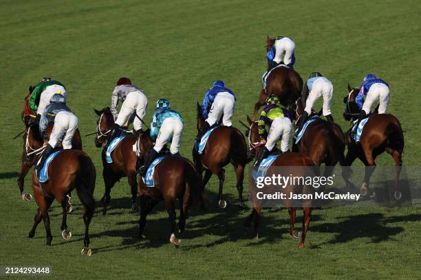 Jockeys and horses ease down after competing in Race 9 The Racing and Sports Doncaster Prelude during Sydney Racing at Rosehill Gardens on March 30,...