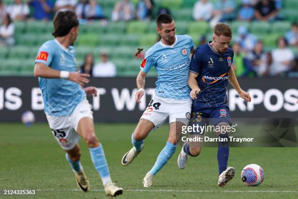 Marin Jakolis of Melbourne City competes with Daniel Wilmering of Newcastle Jets during the A-League Men round 22 match between Melbourne City and...