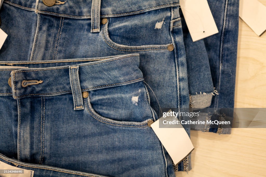 Stacks of folded denim jean short shorts