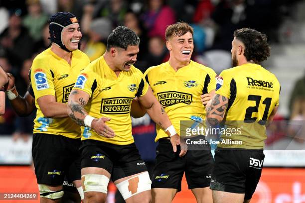 Perenara of the Hurricanes celebrates with his team after scoring a try during the round six Super Rugby Pacific match between Highlanders and...