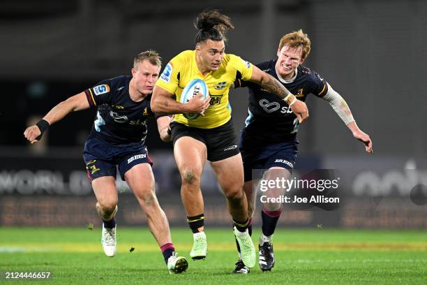 Peter Umaga-Jensen of the Hurricanes charges forward during the round six Super Rugby Pacific match between Highlanders and Hurricanes at Forsyth...