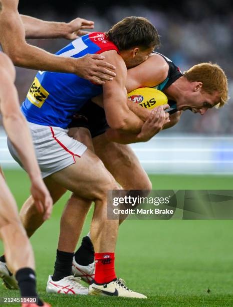 Willem Drew of the Power tackled by Jack Viney of the Demons during the round three AFL match between Port Adelaide Power and Melbourne Demons at...