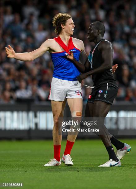 Aliir Aliir of the Power holds Ben Brown of the Demons during the round three AFL match between Port Adelaide Power and Melbourne Demons at Adelaide...