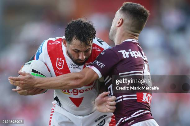 Jack Bird of the Dragons is tackled by Luke Brooks of the Sea Eagles during the round four NRL match between St George Illawarra Dragons and Manly...