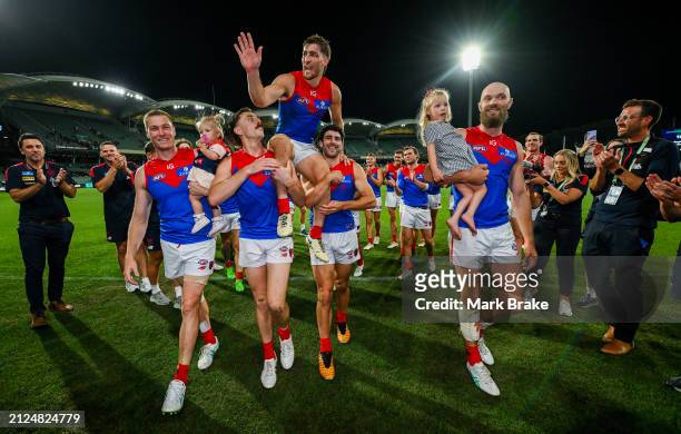 Jack Viney of the Demons is carried off for his 200th game during the round three AFL match between Port Adelaide Power and Melbourne Demons at...