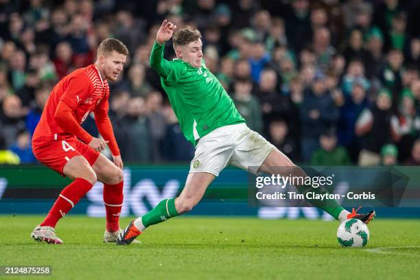 March 26: Evan Ferguson of Ireland defended by Nico Elvedi of Switzerland during the Republic of Ireland V Switzerland, International friendly match...