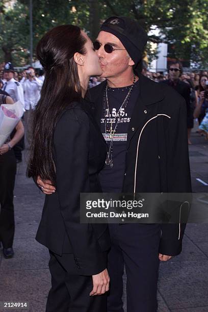 Actress Angelina Jolie kisses husband, actor Billy Bob Thornton, at the UK premiere of her new film 'Lara Croft: Tomb Raider' at the Empire Cinema on...