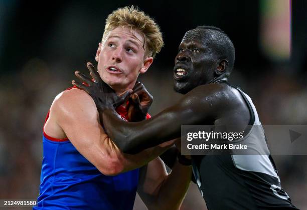 Jacob van Rooyen of the Demons competes for a mark against Aliir Aliir of the Power during the round three AFL match between Port Adelaide Power and...