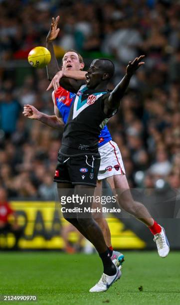 Harrison Petty of the Demons competes with Aliir Aliir of the Power during the round three AFL match between Port Adelaide Power and Melbourne Demons...