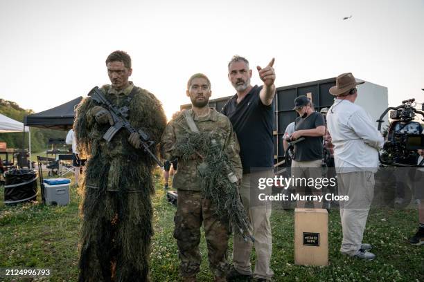 Director Alex Garland with actors Jin Ha on the set of the film 'Civil War', Atlanta, GA, 2022.