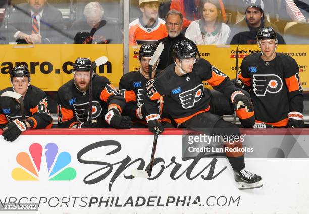 Olle Lycksell, Nicolas Deslauriers, Noah Cates, Joel Farabee and Bobby Brink, of the Philadelphia Flyers watch the play on the ice during the first...