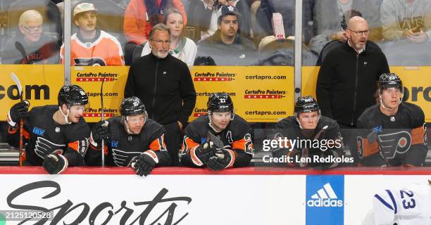 Joel Farabee, Bobby Brink, Scott Laughton, Olle Lycksell and Ronnie Attard of the Philadelphia Flyers watch the play on the ice during the first...