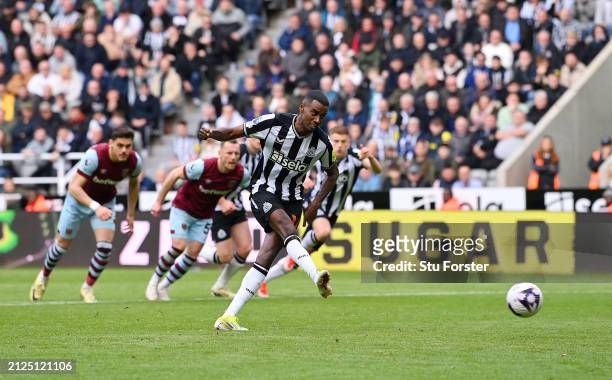 Alexander Isak of Newcastle United scores his team's second goal from the penalty spot during the Premier League match between Newcastle United and...