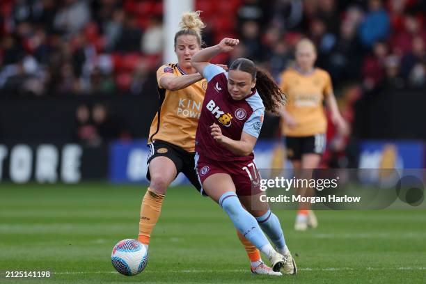 Sophie Howard of Leicester City battles for possession with Ebony Salmon of Aston Villa during the Barclays Women´s Super League match between Aston...