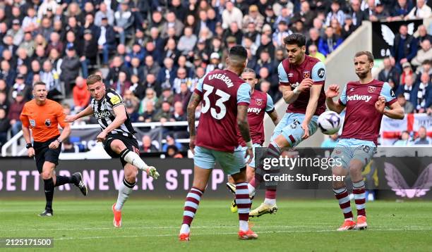 Harvey Barnes of Newcastle shoots to score the 4th Newcastle goal during the Premier League match between Newcastle United and West Ham United at St....