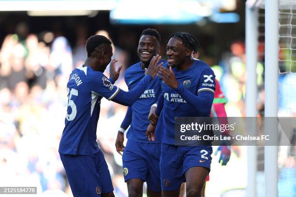 Axel Disasi of Chelsea celebrates scoring his team's first goal with teammates Nicolas Jackson and Benoit Badiashile during the Premier League match...