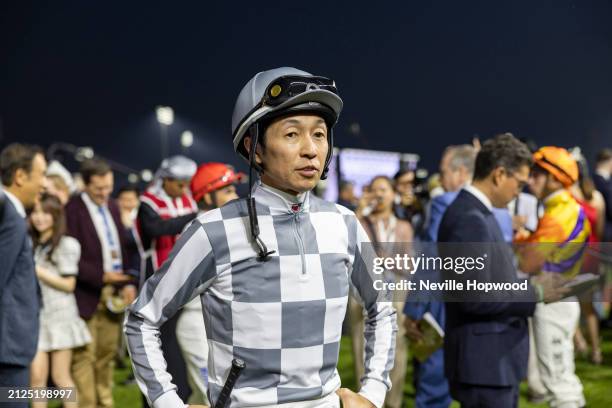 Yutaka Take wits for his mount to arrive at the Meydan Racecourse on March 30, 2024 in Dubai, United Arab Emirates.