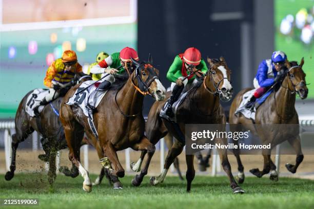 Namur under Cristian Demuro beats Facteur Cheval under Maxime Gyon to win the 9f Group 1 Dubai Turf at the Meydan Racecourse on March 30, 2024 in...