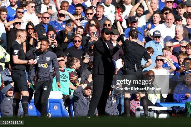 Vincent Kompany, Manager of Burnley, is shown a red card by Referee Darren England during the Premier League match between Chelsea FC and Burnley FC...