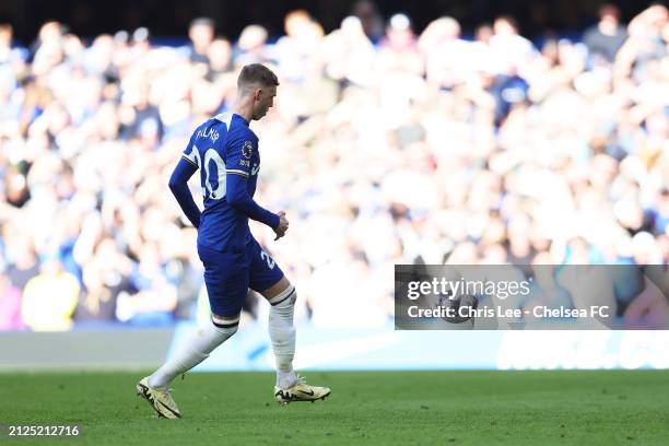 Cole Palmer of Chelsea scores his team's first goal from a penalty kick during the Premier League match between Chelsea FC and Burnley FC at Stamford...