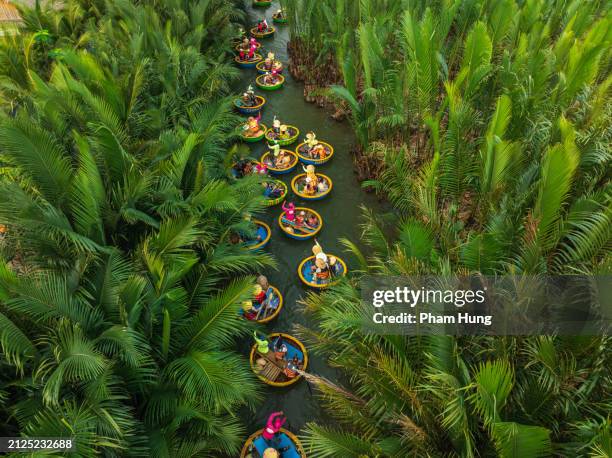 basketboat tours in bay mau nipa palm forest - hoi an stockfoto's en -beelden