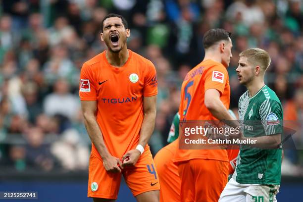 Maxence Lacroix of VfL Wolfsburg reacts after being shown a red card during the Bundesliga match between SV Werder Bremen and VfL Wolfsburg at...