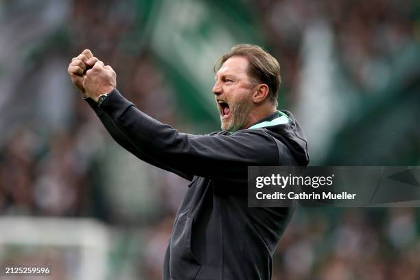 Ralph Hasenhuettl, Head Coach of VfL Wolfsburg, celebrates after Lovro Majer of VfL Wolfsburg scores his team's second goal during the Bundesliga...