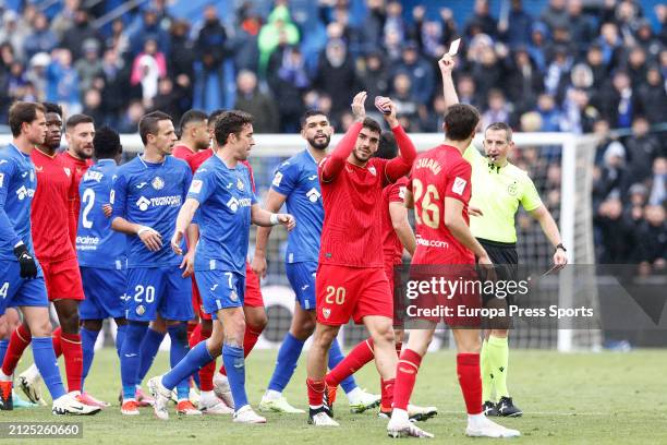 Isaac Romero of Sevilla FC receives a yellow card during the LaLiga EA Sports match between Getafe CF and Sevilla FC at Coliseum de Getafe stadium on...