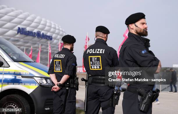 Police interact outside the stadium prior the Bundesliga match between FC Bayern München and Borussia Dortmund at Allianz Arena on March 30, 2024 in...