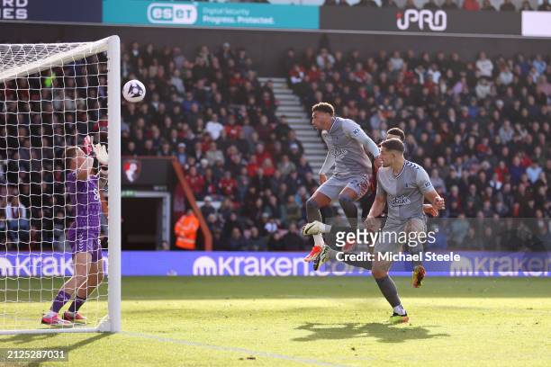 Dominic Solanke of AFC Bournemouth scores his team's first goal after winning a header against Ben Godfrey and James Tarkowski during the Premier...