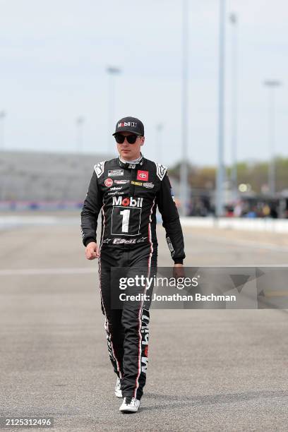 Christopher Bell, driver of the Mobil 1 Toyota, walks the grid during qualifying for the NASCAR Cup Series Toyota Owners 400 at Richmond Raceway on...