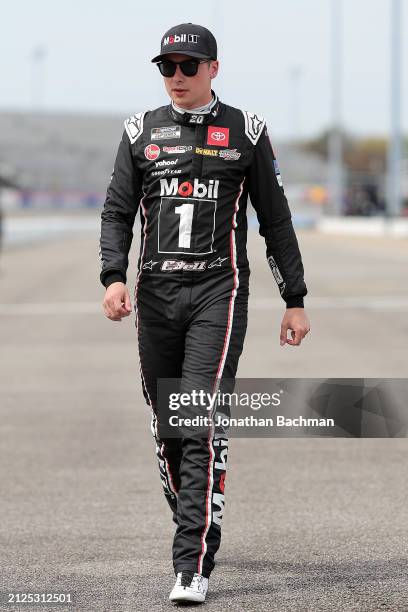 Christopher Bell, driver of the Mobil 1 Toyota, walks the grid during qualifying for the NASCAR Cup Series Toyota Owners 400 at Richmond Raceway on...