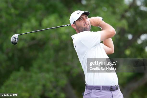 Scottie Scheffler of the United States hits a tee shot on the first hole during the third round of the Texas Children's Houston Open at Memorial Park...