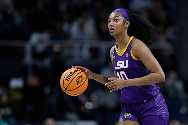 Angel Reese of the LSU Tigers dribbles with the ball against the UCLA Bruins during the first half in the Sweet 16 round of the NCAA Women's...