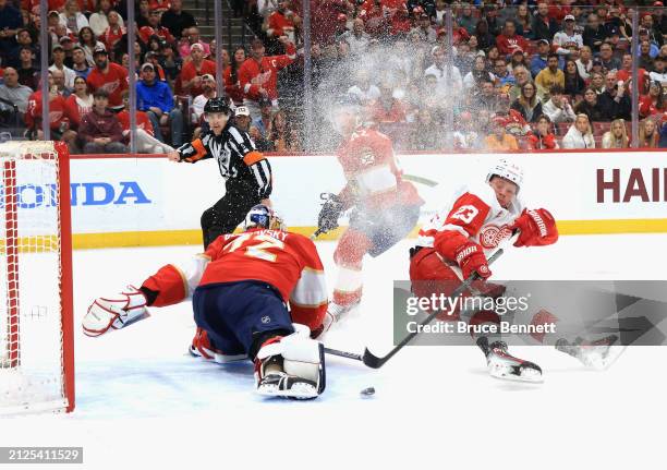 Sergei Bobrovsky of the Florida Panthers makes the first period save on Lucas Raymond of the Detroit Red Wings at Amerant Bank Arena on March 30,...