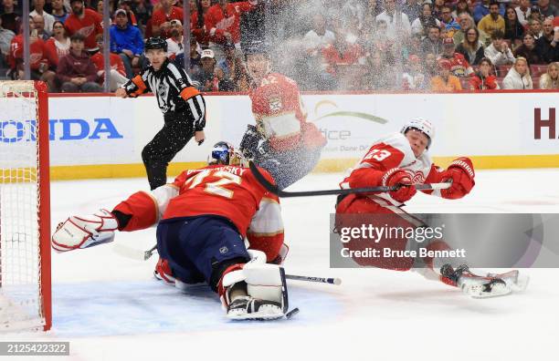 Sergei Bobrovsky of the Florida Panthers makes the first period save on Lucas Raymond of the Detroit Red Wings at Amerant Bank Arena on March 30,...