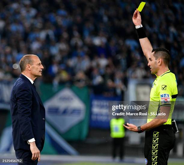 The refereee Andrea Colombo shows a yellow card to Juventus head coach Massimiliano Allegri during the Serie A TIM match between SS Lazio and...