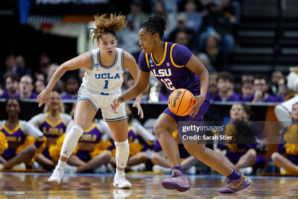 Mikaylah Williams of the LSU Tigers dribbles against Kiki Rice of the ...