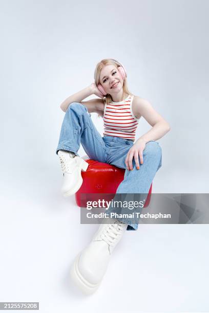 cool attitude and stylish woman using wireless headphone - tears happiness stock pictures, royalty-free photos & images