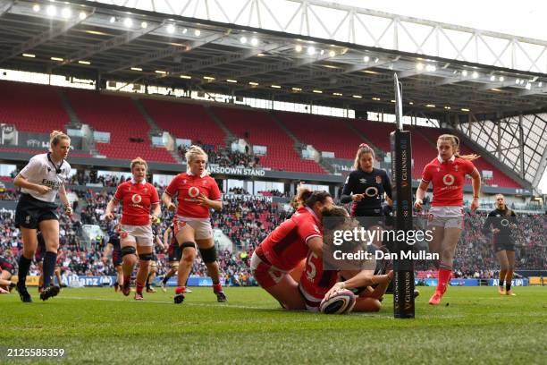 Ellie Kildunne of England goes over to score her team's eighth try during the Guinness Women's Six Nations 2024 match between England and Wales at...