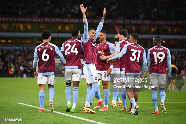 Ezri Konsa of Aston Villa celebrates scoring his team's second goal with teammates during the Premier League match between Aston Villa and...