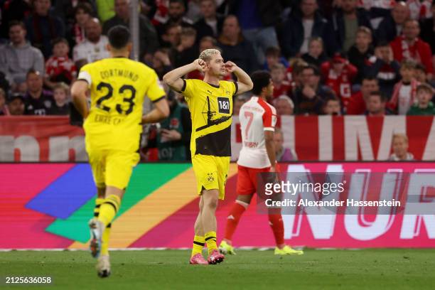 Julian Ryerson of Borussia Dortmund celebrates scoring his team's second goal during the Bundesliga match between FC Bayern München and Borussia...